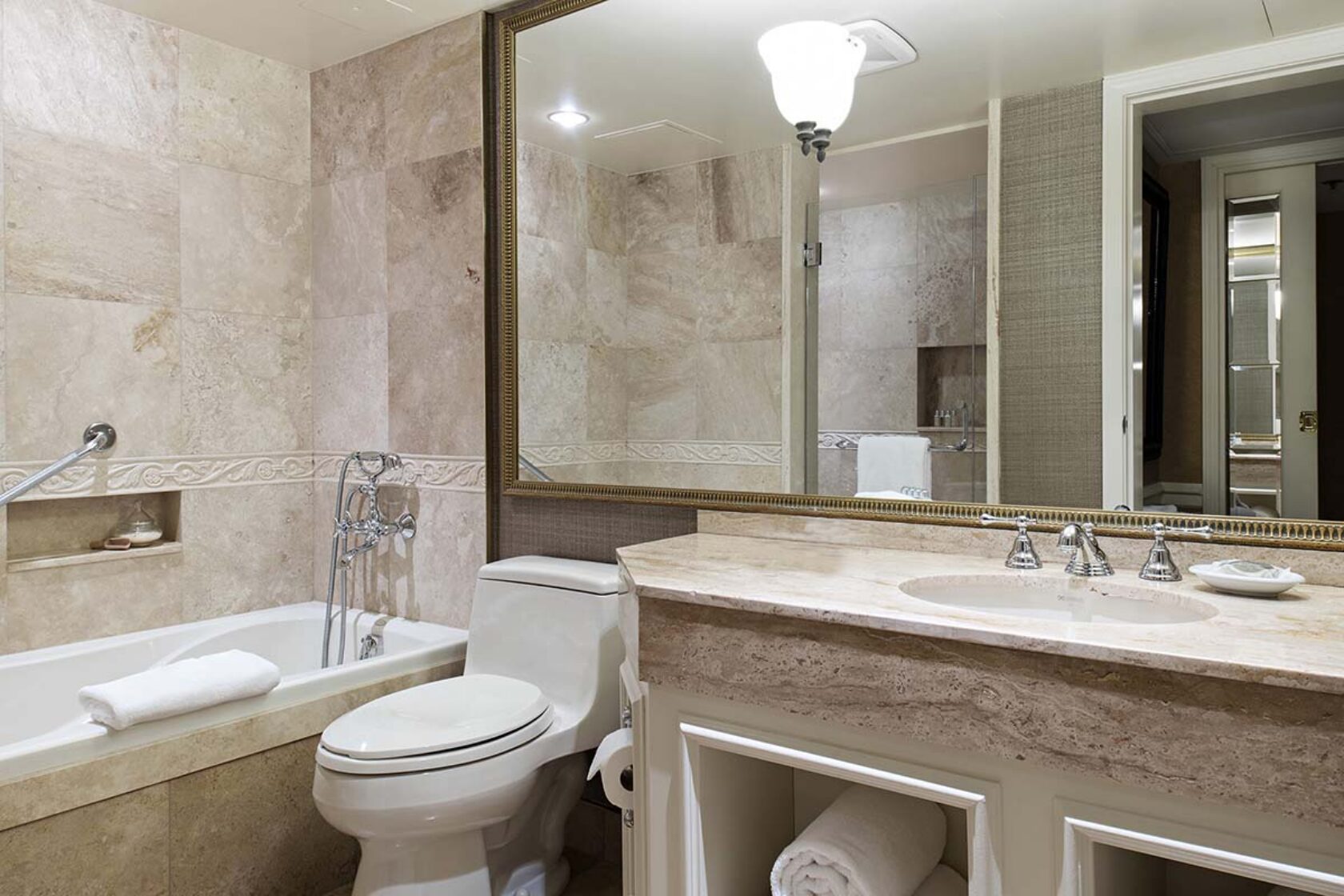 Four-piece marble bathroom with soaker tub and walk-in shower