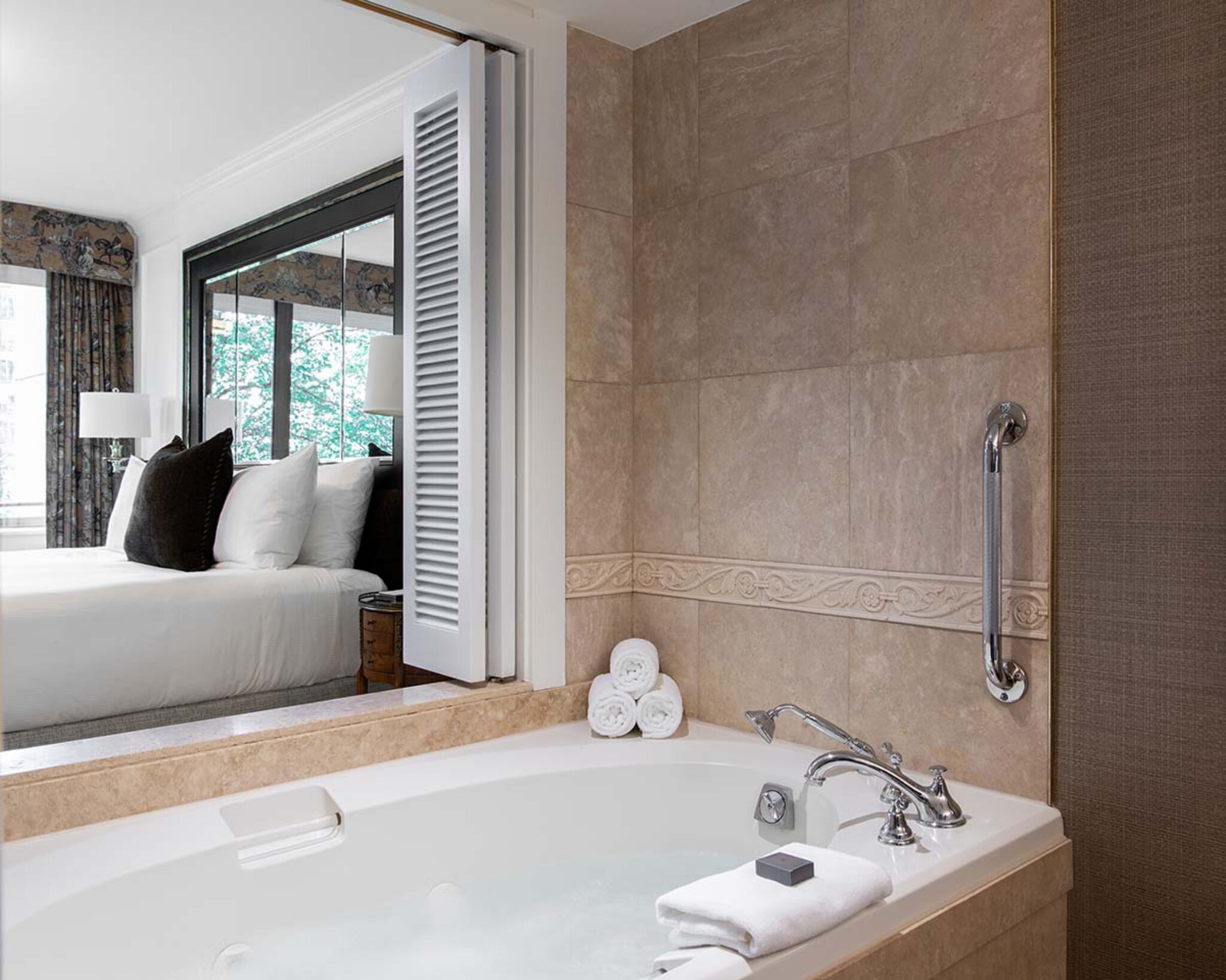 Deluxe Suite with a King Bed, featuring Brown Equestrian Accents
