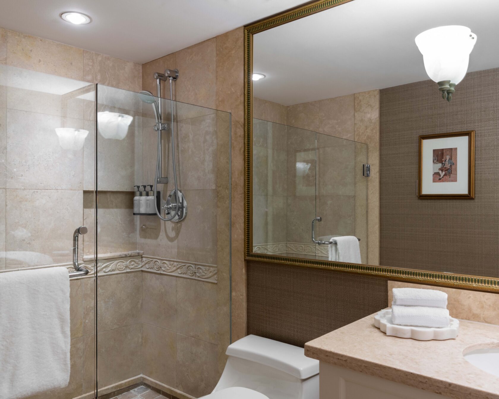 Four-piece marble bathroom with soaker tub and walk-in shower